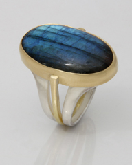 A commissioned Pevsner style ring with a Large oval Labradorite stone
